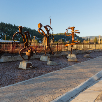 Three brown contemporary art sculptures of musicians