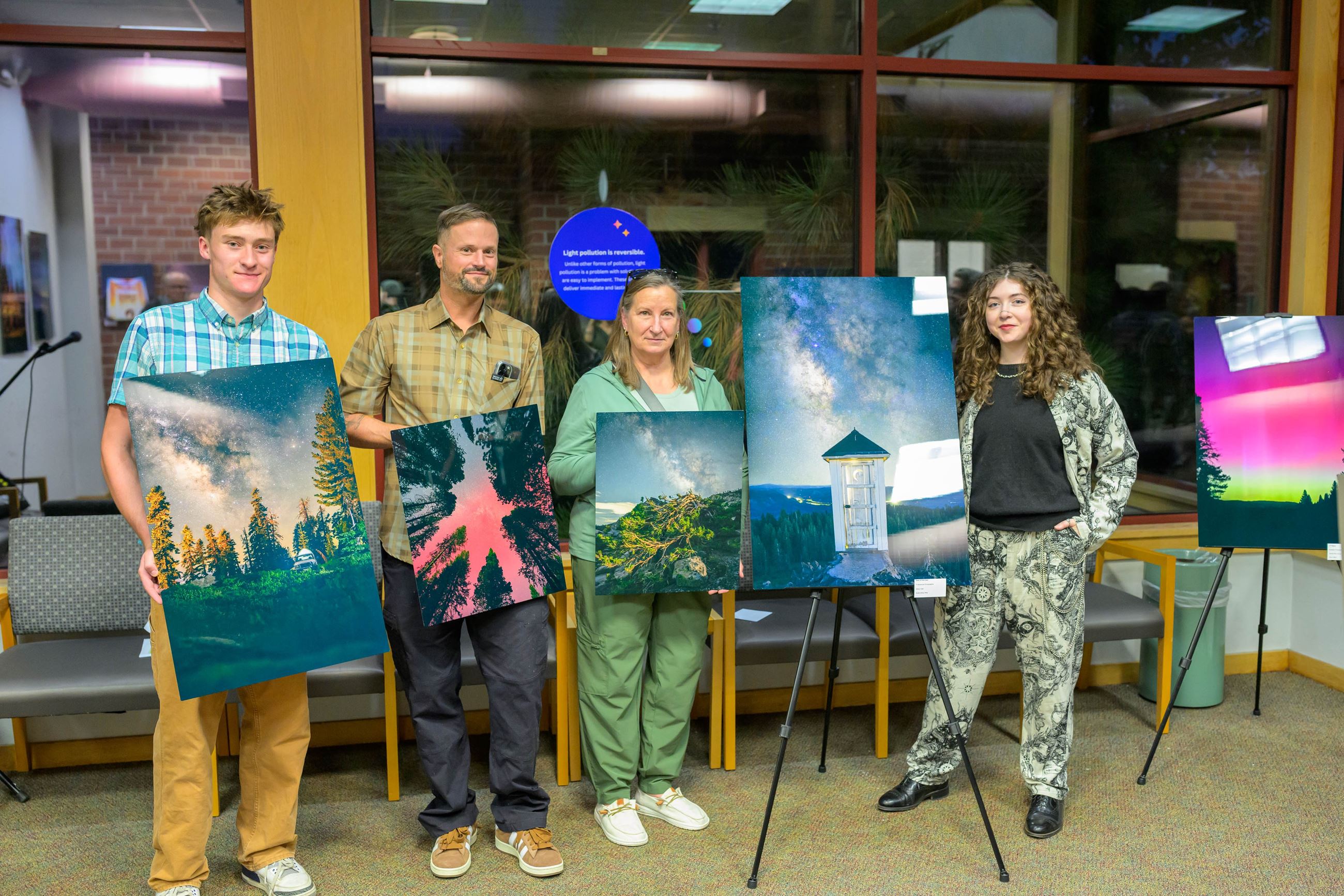 four of the Dark Skies winners pictured with their selected photographs. 